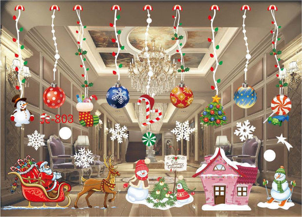 Colorful Christmas window stickers with Santa, reindeer, snowmen, ornaments, candy canes, and holiday decorations hanging in a festive room