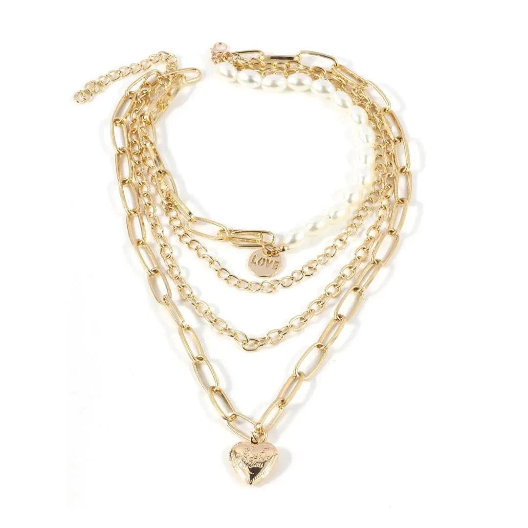 Jester Necklace - Dazzling Chain with Pearls & Heart featuring layered gold chains and a heart charm.