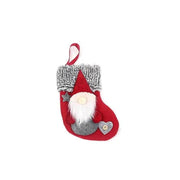Red home Christmas stocking decoration with gnome and faux fur cuff hanging pendant