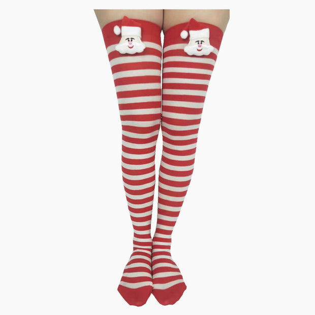 Red and white striped Christmas stockings with Santa Claus decoration and pom-pom on top