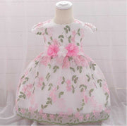 Summer floral baby girl dress with pink flowers and green leaves for birthday and wedding parties