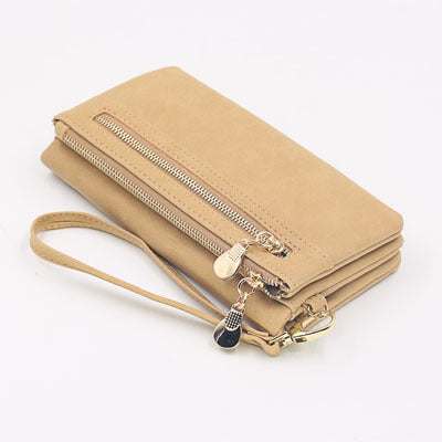 Beige women's long wallet with zipper, multiple compartments, and wrist strap made of high-quality PU leather.