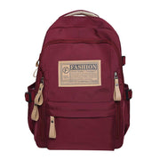 Solid multi-pocket backpack in maroon nylon with large capacity for school and travel