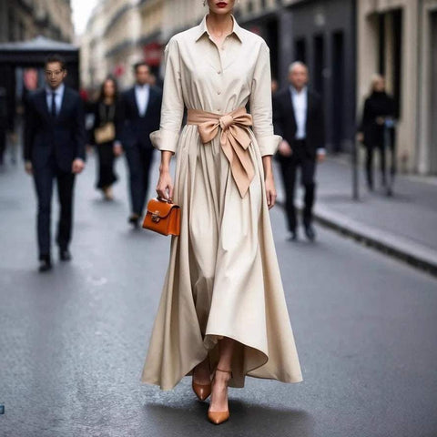 Beige solid color maxi dress with lace-up waist belt and asymmetric hem, street fashion style.