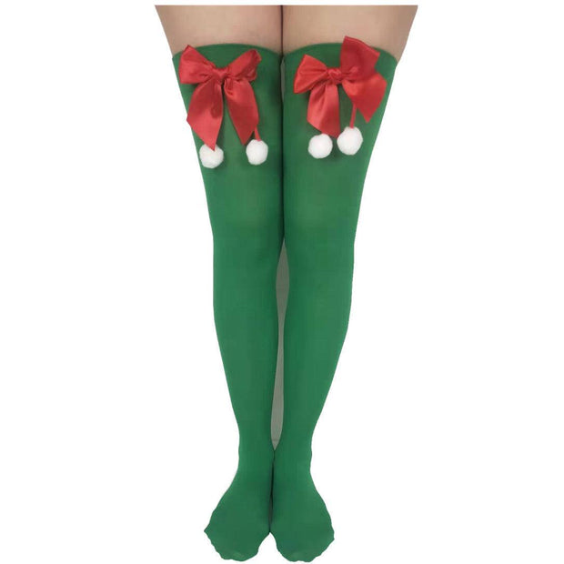 Green Christmas stockings with red bows and white pom-poms party socks