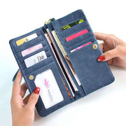 Blue women's long wallet open showing multiple card slots and compartments with zipper closure