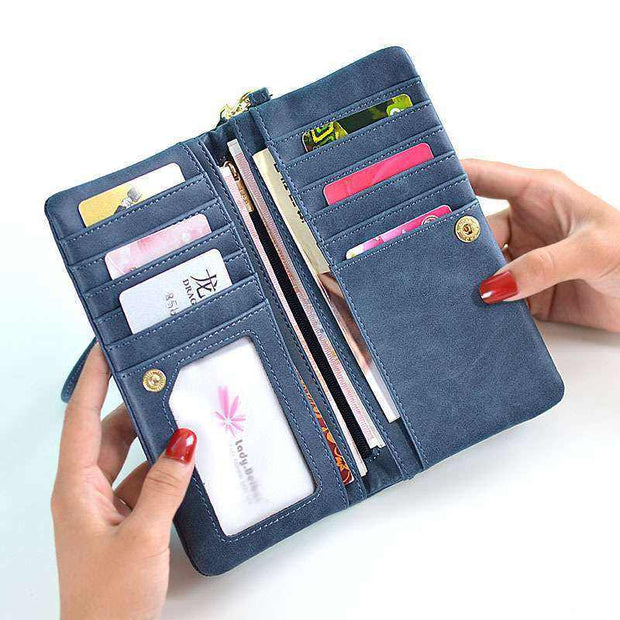 Blue women's long wallet open showing multiple card slots and compartments with zipper closure