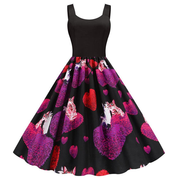 Valentine's Day print party dress with black top and heart-patterned skirt featuring cats and purple-red designs