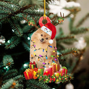Christmas wooden pendant decoration featuring a dog in a Santa hat with holiday lights and gifts hanging on a Christmas tree