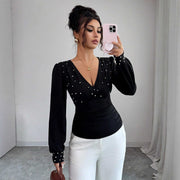 Women’s black V-neck pearl embellished fitted long sleeve top with bell sleeves