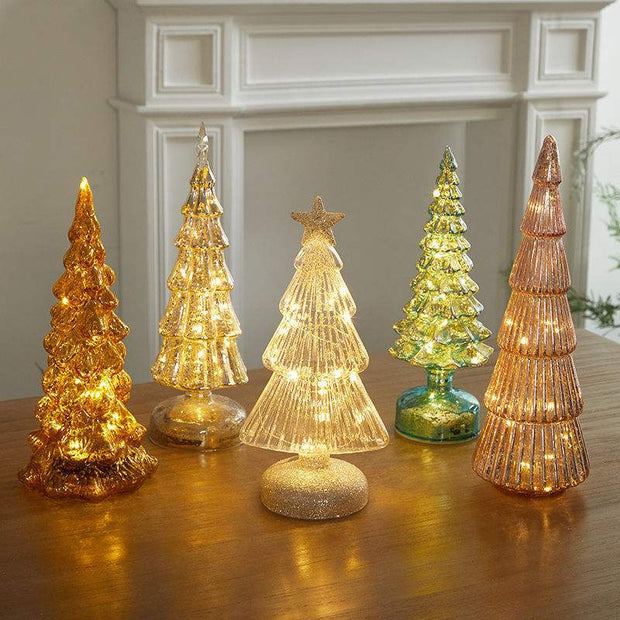 Glowing geometric glass Christmas tree table decorations in various gold and green tones with integrated lights