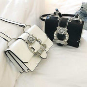Luxury fashion designer bags for women with diamond lock embellishments in black and white colors