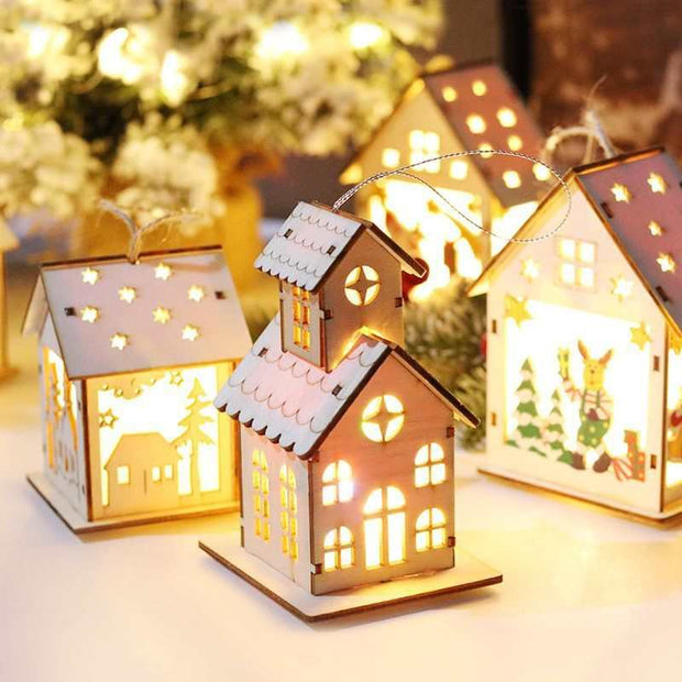 Luminous wooden Christmas decorative houses with LED lights illuminating cozy holiday scenes