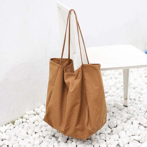 Large brown canvas women handbag with high capacity and shoulder straps for shopping tote