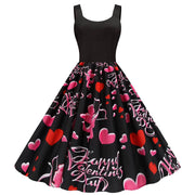 Black sleeveless party dress with Valentine's Day print featuring pink cupids, hearts, and "Happy Valentine's Day" text