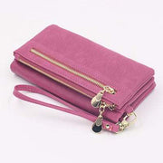 pink women's long wallet with zipper and wrist strap made of PU leather