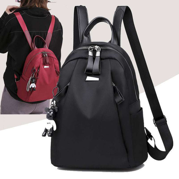 Ins Fashion Backpack for women in black and red, small Oxford cloth school and travel bag with zipper closures and cute bear keychain accessory