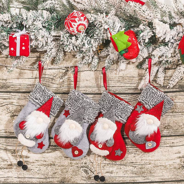 Home Christmas stockings decorations pendant with Santa design hanging on wooden background