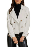 Women's fashion office jacket with notched lapel, double-breasted design, and buckle sleeves in light beige.