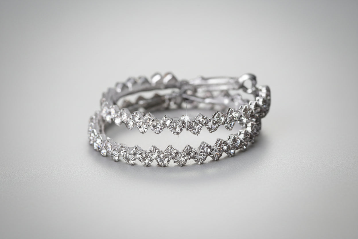 Elegant geometric crystal stud earrings with sparkling simulated diamonds on black background