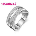 Sterling silver unisex fashion ring with cubic zirconia inlay and geometric overpass cross design