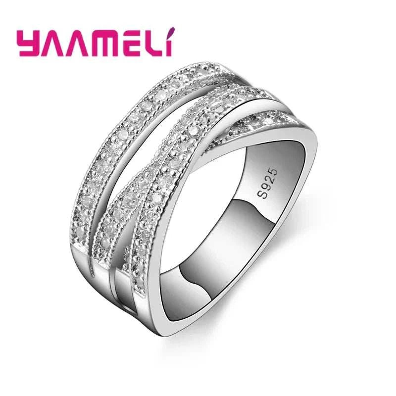 Sterling silver unisex fashion ring with cubic zirconia inlay and geometric overpass cross design