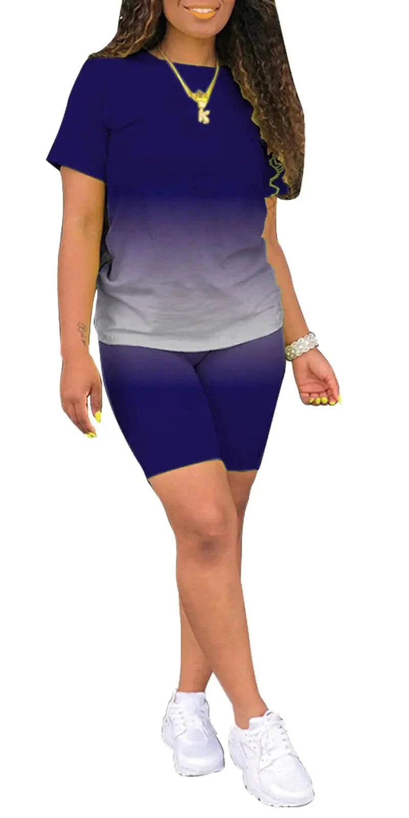 Woman wearing CHBAZH two-piece jogger sets for women in blue gradient with white sneakers