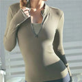 woman wearing quick dry slimming yoga top in beige with zipper and thumb holes