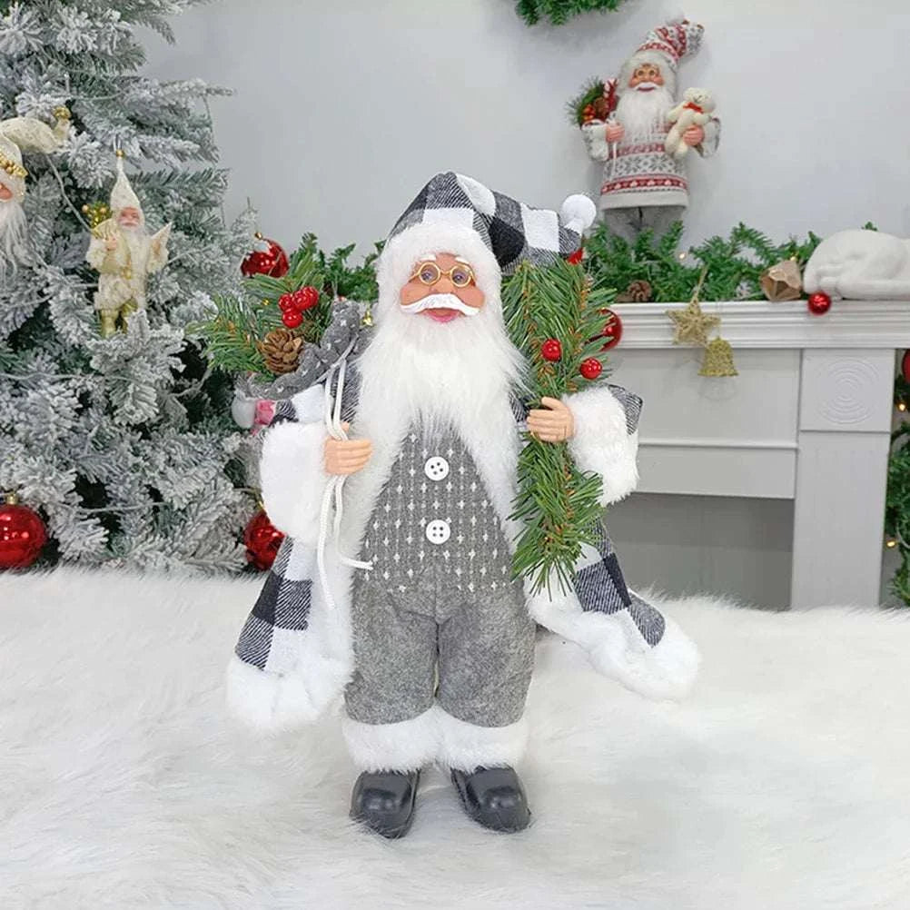 Standing Santa Claus Christmas decoration doll in black and white check outfit holding greenery for holiday décor