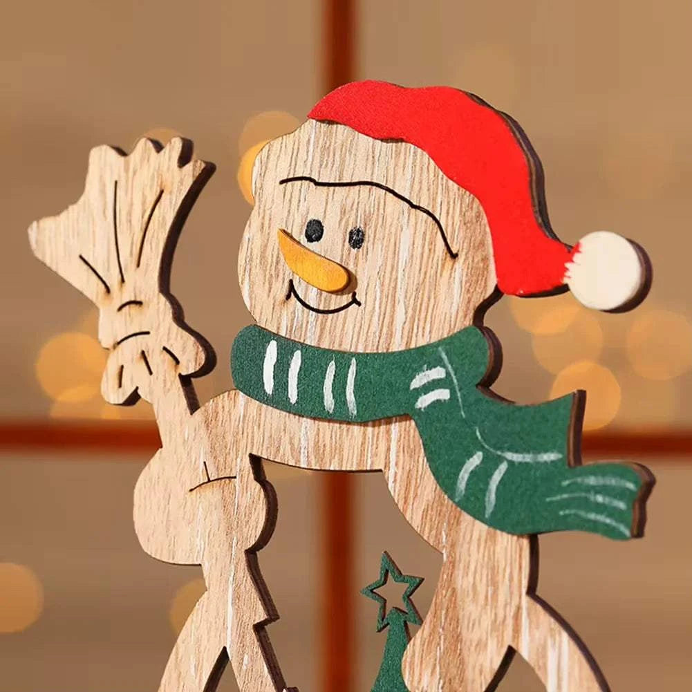 Wooden Christmas decoration ornament of a snowman wearing a red Santa hat and green scarf, holding a broom, festive DIY desktop decor
