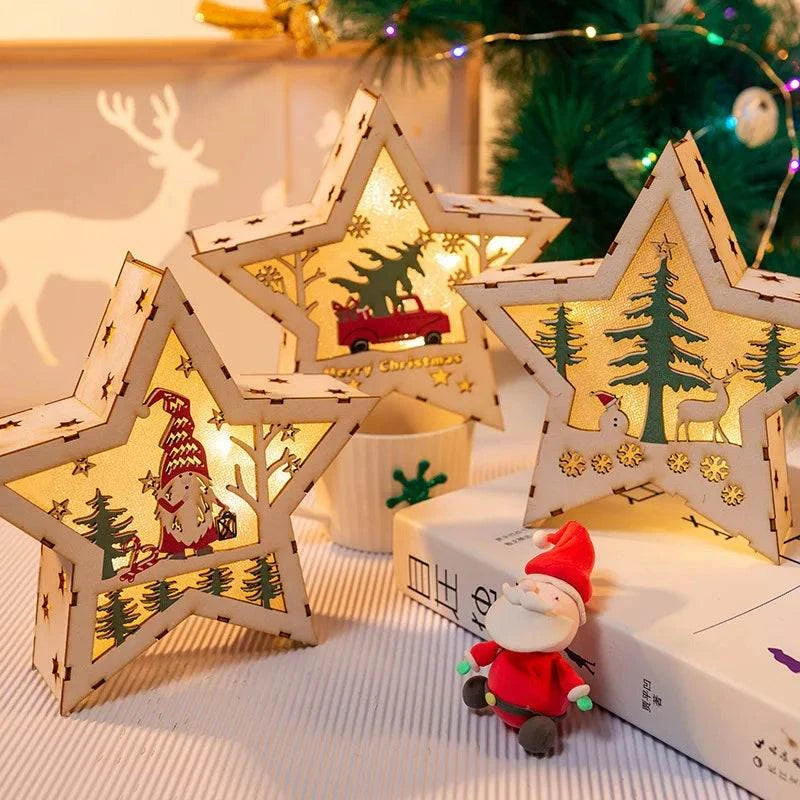 Luminous wooden star-shaped Christmas decorations with festive cutouts and warm light, placed near a Santa figurine and Christmas tree.