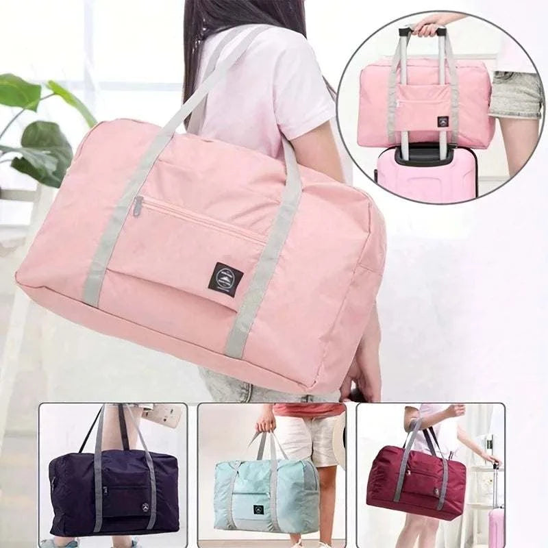 foldable large capacity pink travel duffle bag with grey straps for weekend and sports use
