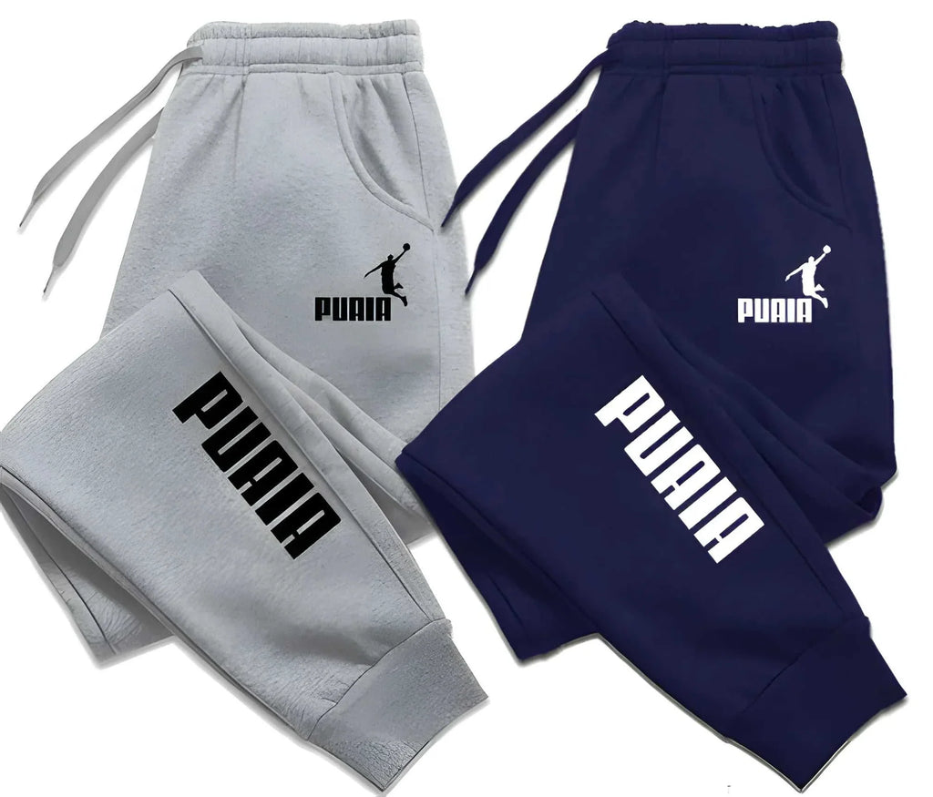 Mens print pants in grey and navy blue with elastic waist and PUMA logo for casual and sportswear
