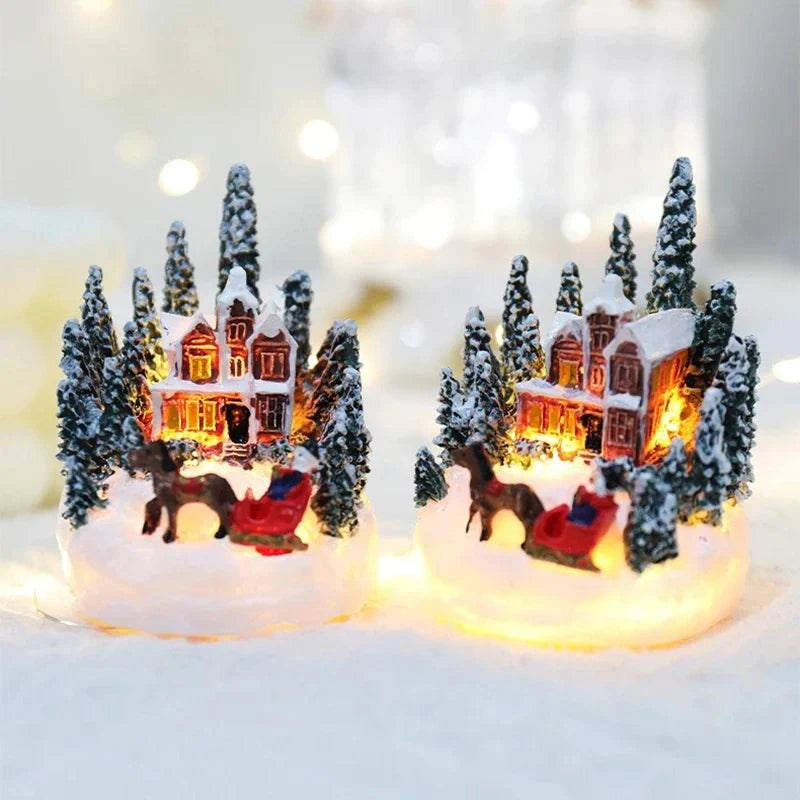 LED Christmas Decorations with miniature snowy houses and trees illuminated by warm lights