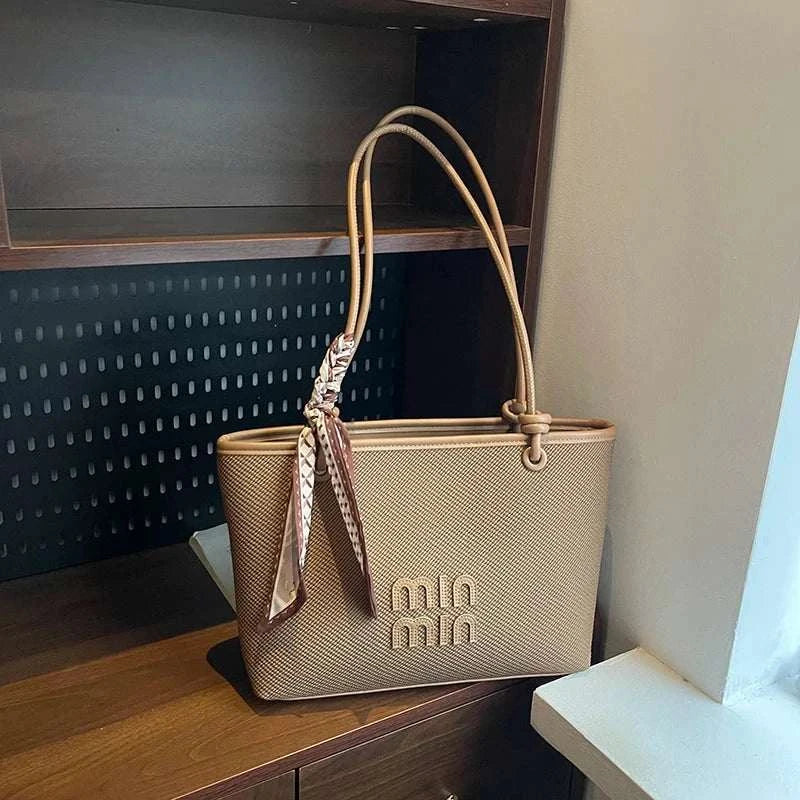Stylish beige tote shopper bag with large capacity and minimalist design for daily shopping and commuting