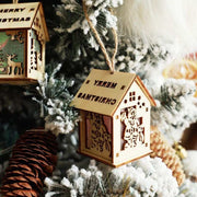 Wooden luminous Christmas decorations with LED lights hanging on frosted tree branches