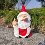 Santa Claus statue garden Christmas decoration with red outfit and smoking pipe