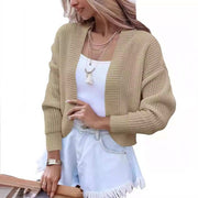 Women's short cape knitted cardigan sweater in camel color with long sleeves and polyester fabric.