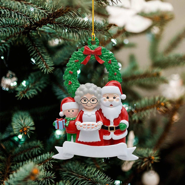 Christmas wooden pendant decoration with Santa Claus, Mrs. Claus, elf, and festive wreath hanging on tree