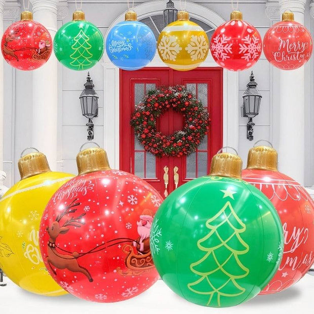 Inflatable Christmas balls in red, green, blue, and yellow with festive holiday designs for outdoor garden decoration