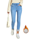 Women wearing light blue fleece lined skinny jeans with elastic waist pull-on design and rolled cuffs